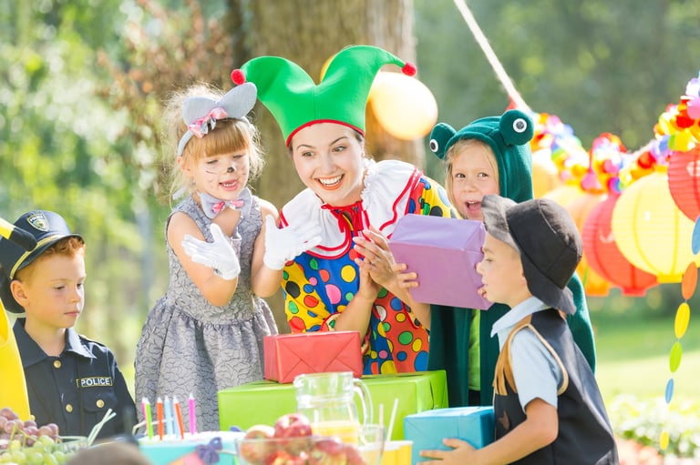 Woman as a clown giving presents for kids on a party